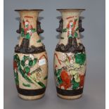 A pair of Chinese crackle glaze 'warrior' vases, Guangxu period (1875-1908) height 25cm