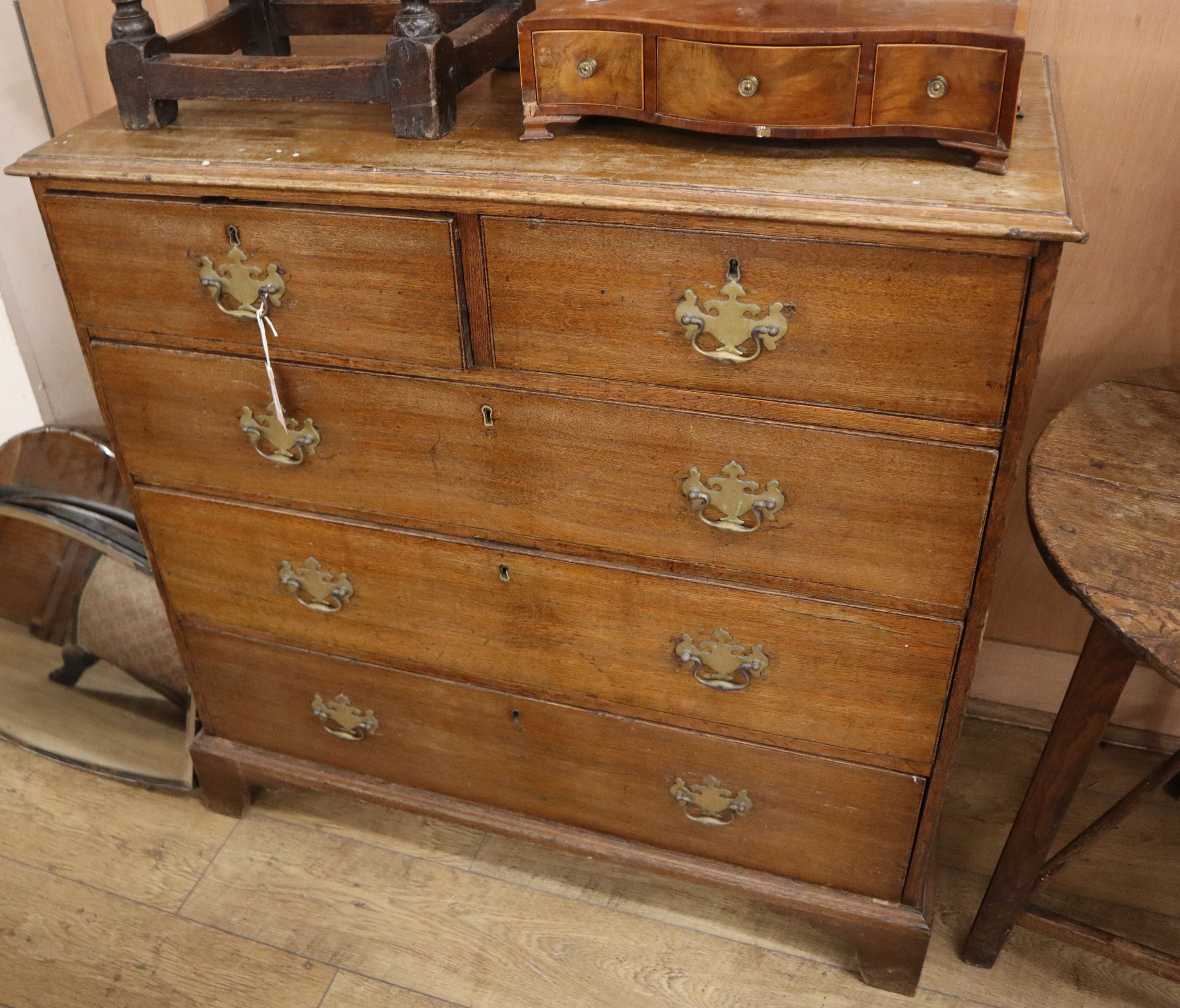 A George III oak chest of drawers W.102cm