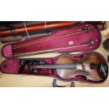 A cased violin and two bows