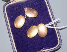 A pair of 9ct gold oval cuff links.