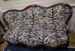 A French Victorian mahogany double spoon back settee upholstered in faux zebra fabric W.180cm