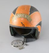 A vintage Cromwell motor cycle helmet with Vincent/Isle of Man badging and two Vincent Owners Club