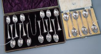 A set of 12 silver scroll terminal coffee spoons and matching sugar tongs and a set of six silver