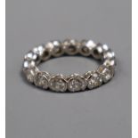 A modern 18ct white gold and diamond full eternity ring, set with fifteen part collet set round