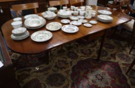 A George III-style mahogany drop leaf extending dining table 220cm extended