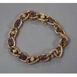 A yellow metal fancy curb-link bracelet set with cabochon sapphires and pearls.