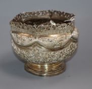 A Burmese white metal circular bowl with pierced hexagonal border, height 13.3cm, 10 oz.