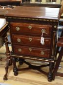 A small 19th century Continental mahogany and parcelgilt three drawer chest with X stretcher H.86cm