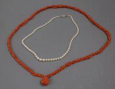 A coral ropetwist necklace with coral cluster drop and a single strand graduated cultured pearl