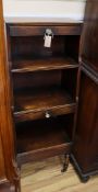 An early 19th century mahogany narrow graduated bookcase (altered) H.132cm