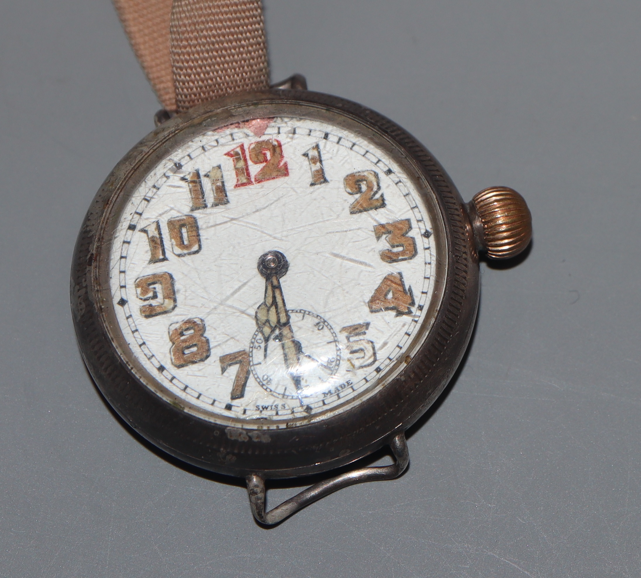 A gentleman's early 20th century white metal cased manual wind wrist watch, with Arabic dial and