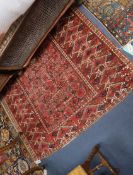 A North West Persian red ground carpet 300 x 140cm