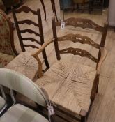 A 19th century provincial beech elbow chair and a ladder back chair