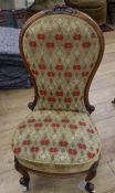 A Victorian walnut spoonback chair