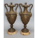 A pair of gilt spelter urns