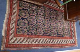 An Afghan rug, woven with rows of botehs 180 x 116cm