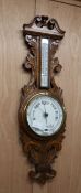 A late Victorian oak barometer / thermometer H.86cm