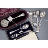 An Edwardian silver Christening set, a Victorian silver sifter spoon and a quantity of miscellaneous