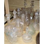 A collection of cut glass decanters and stoppers