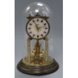 A brass 400 day clock under glass dome