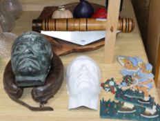 A wooden bowl, novelty penknife, leather support collar, two death masks, etc.