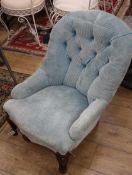 A Victorian buttoned spoonback armchair