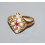 A George V 18ct gold, split pearl and ruby set cluster marquise shaped dress ring, size M.