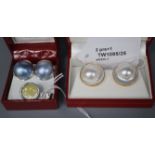 A pair of 18K white metal and coloured mabe pearl earrings, a pair of 14K and mabe pearl earrings