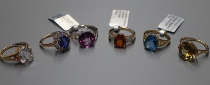 A 9ct white gold and mystic pink topaz ring and five 9ct yellow gold dress rings including a