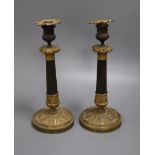 A pair of William IV bronze and ormolu candlesticks height 30cm