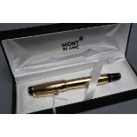 A Montblanc 'Boheme' gold-toned rollerball pen, with faux topaz jewel to clip, boxed