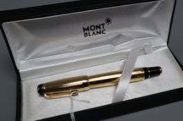 A Montblanc 'Boheme' gold-toned rollerball pen, with faux topaz jewel to clip, boxed