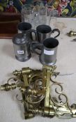 A pair of Victorian brass brackets and assorted tankards