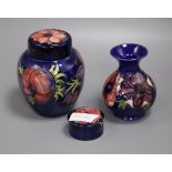 A Moorcroft anemone jar, vase and lidded pot tallest 16cm