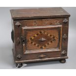 An inlaid oak spice cabinet, carved with the date, 1672 W.29cm