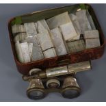 A quantity of Victorian mother of pearl gaming counters and a pair of opera glasses
