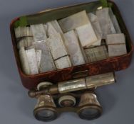 A quantity of Victorian mother of pearl gaming counters and a pair of opera glasses