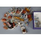 A collection of silver and white metal jewellery, variously set with amber, hardstones, enamels