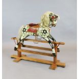 A Collinson carved and painted wood rocking horse, original paint and original cow mane and tail,