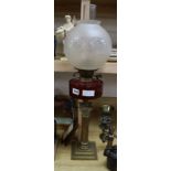 A brass and cranberry glass oil lamp height 70cm