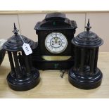 A Victorian black slate mantel clock and a pair of Portico side ornaments clock 31cm