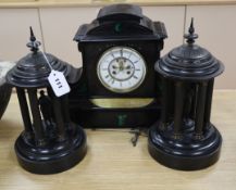 A Victorian black slate mantel clock and a pair of Portico side ornaments clock 31cm