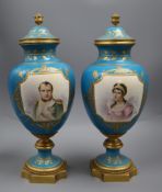 A pair of Sevres style 'Napoleon & Josephine' bleu celeste vases and covers, late 19th century