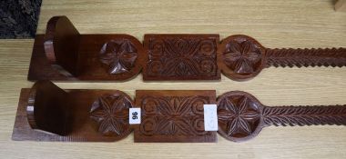 A pair of Scandinavian carved oak wall sconces height 69cm