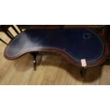 A leather top mahogany kidney shape coffee table W.128cm