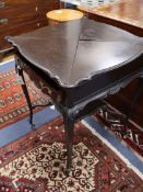 A late Victorian mahogany envelope card table W.60cm
