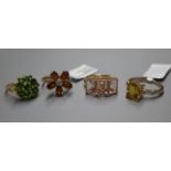 Four 9ct gold gem-set dress rings.