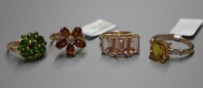 Four 9ct gold gem-set dress rings.