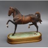 A Royal Worcester model of a Hackney Stallion after Doris Lindner, No. 394/500, with wooden plinth