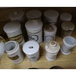 A collection of 19th century Continental ceramic chemist's jars, some with lids